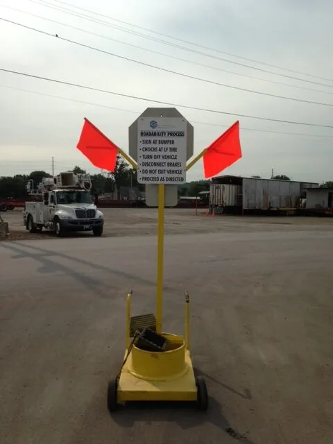 stop sign with safety messages: turn off truck, remove emergency air line, stay in truck