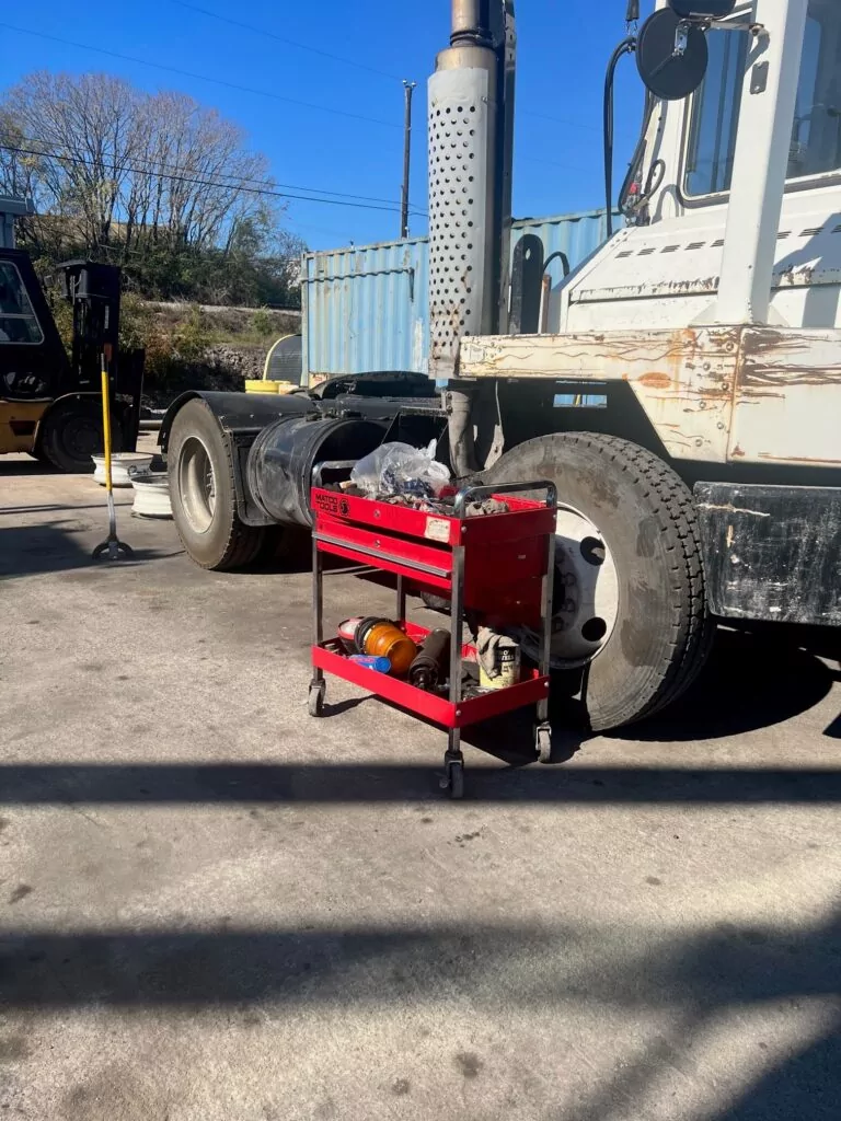 Mobile work station in front of heavy machinery